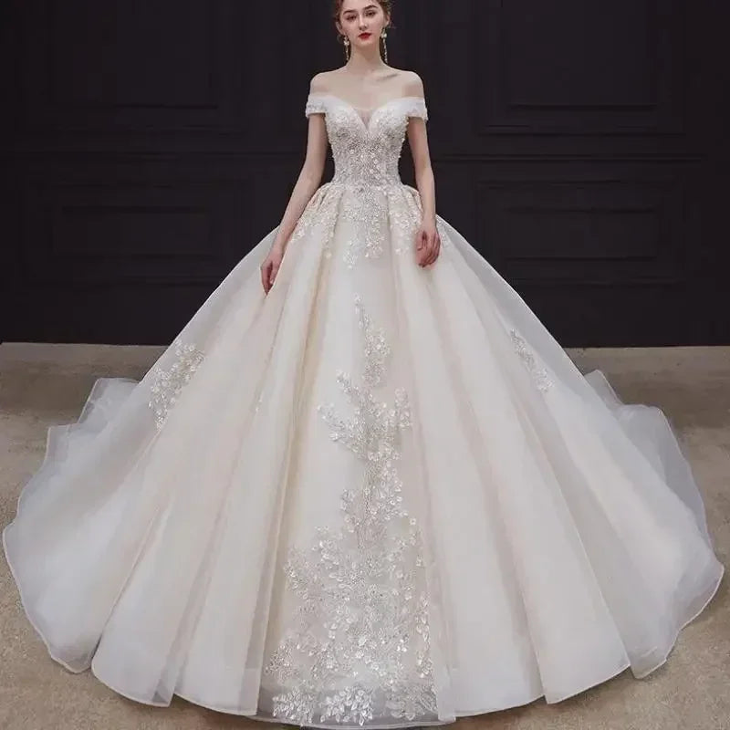 Luxury Off-Shoulder Wedding Dress - Handmade Lace Ball Gown | Femstylo