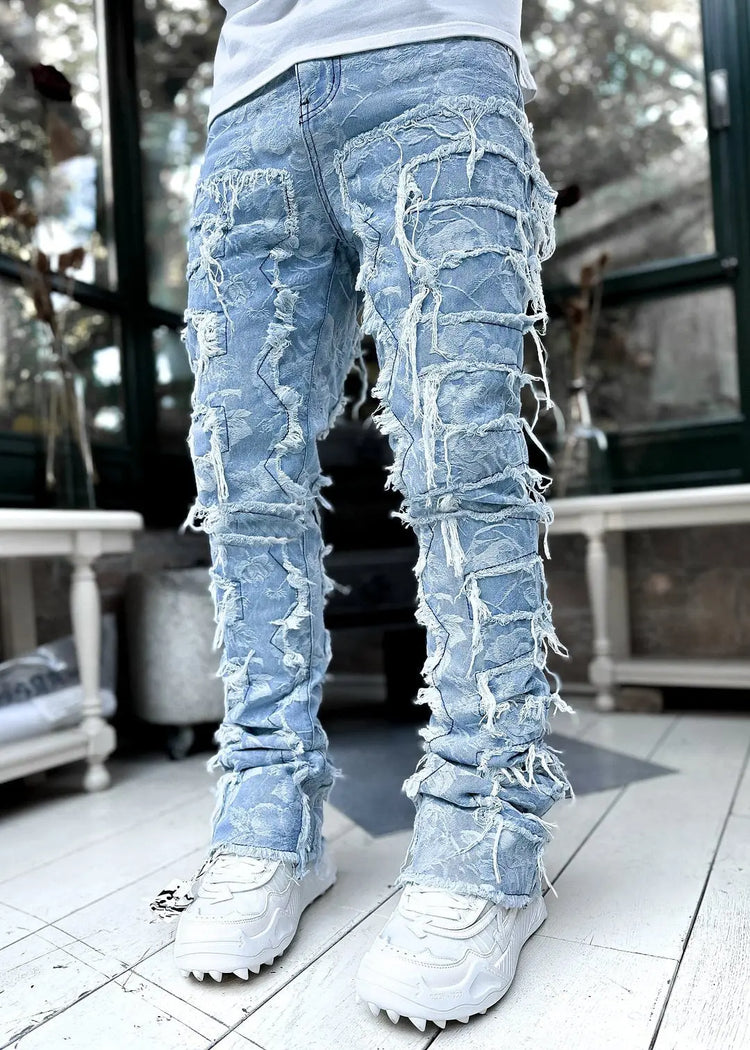 Pink ripped trousers for men with fringes, patched design, long tight fit, and stacked style, by Dropshipman.