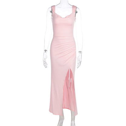 Sleeveless backless dress with adjustable ties and a fitted, slit design