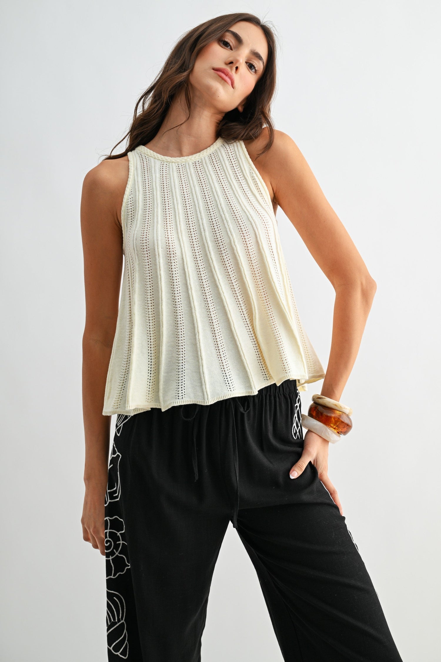 Sleeveless Knit Top With Flared Hem