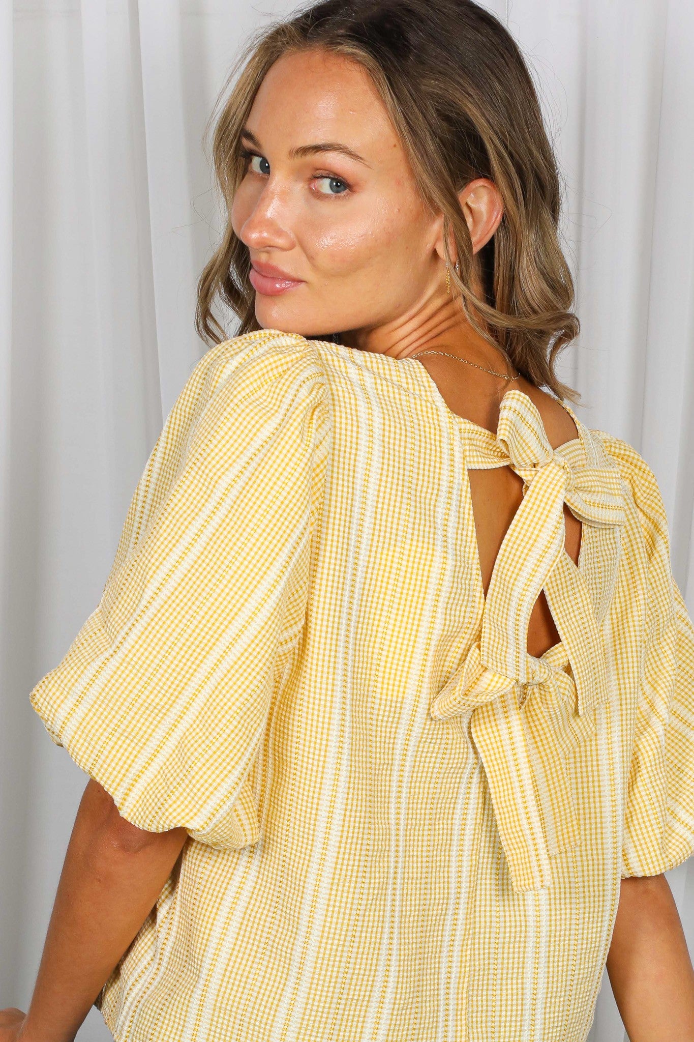 Sweet And Back Bow Accent Plaid Top