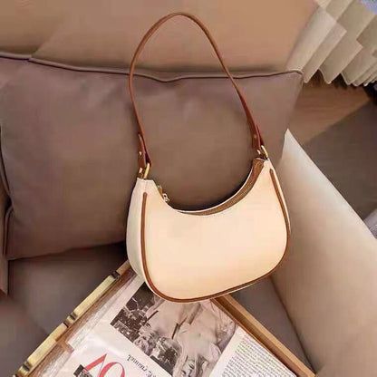 Lady crescent bag slung across one shoulder