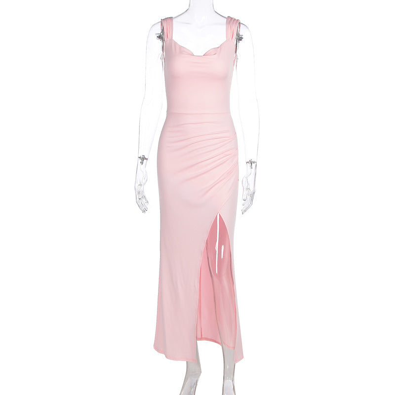 Sleeveless backless dress with adjustable ties and a fitted, slit design