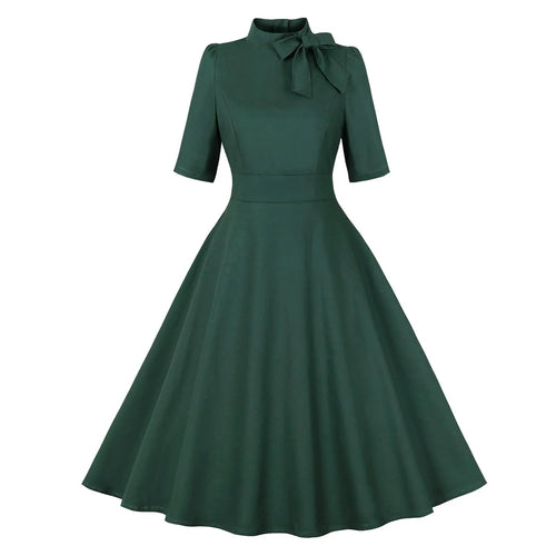 1950s retro swing dress for women in dark green with short sleeves and tie neck detail.