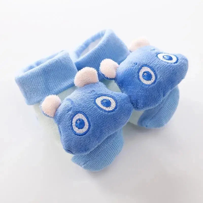 Cute cartoon baby anti-slip socks and shoes for newborns, featuring rattle details and warm cotton material, perfect for first steps.