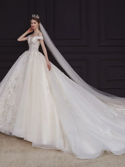 Luxury Off-Shoulder Wedding Dress - Handmade Lace Ball Gown | Femstylo