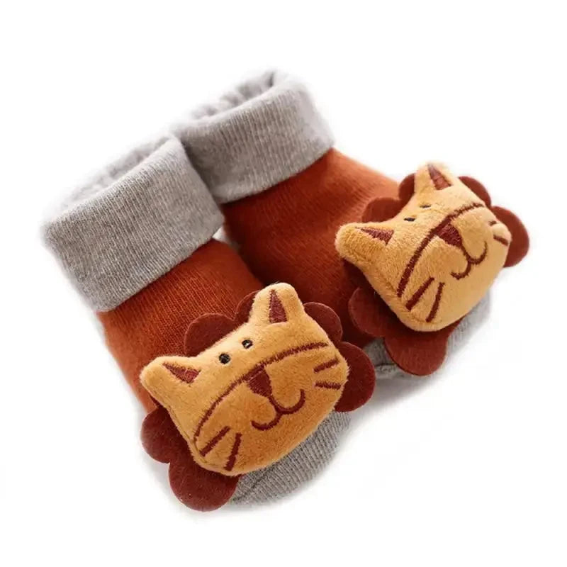Cute cartoon baby anti-slip socks with rattle, warm cotton booties for newborns, ideal for boys and girls during first steps.