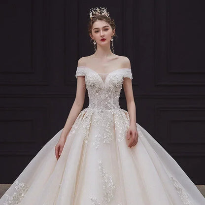 Luxury Off-Shoulder Wedding Dress - Handmade Lace Ball Gown | Femstylo