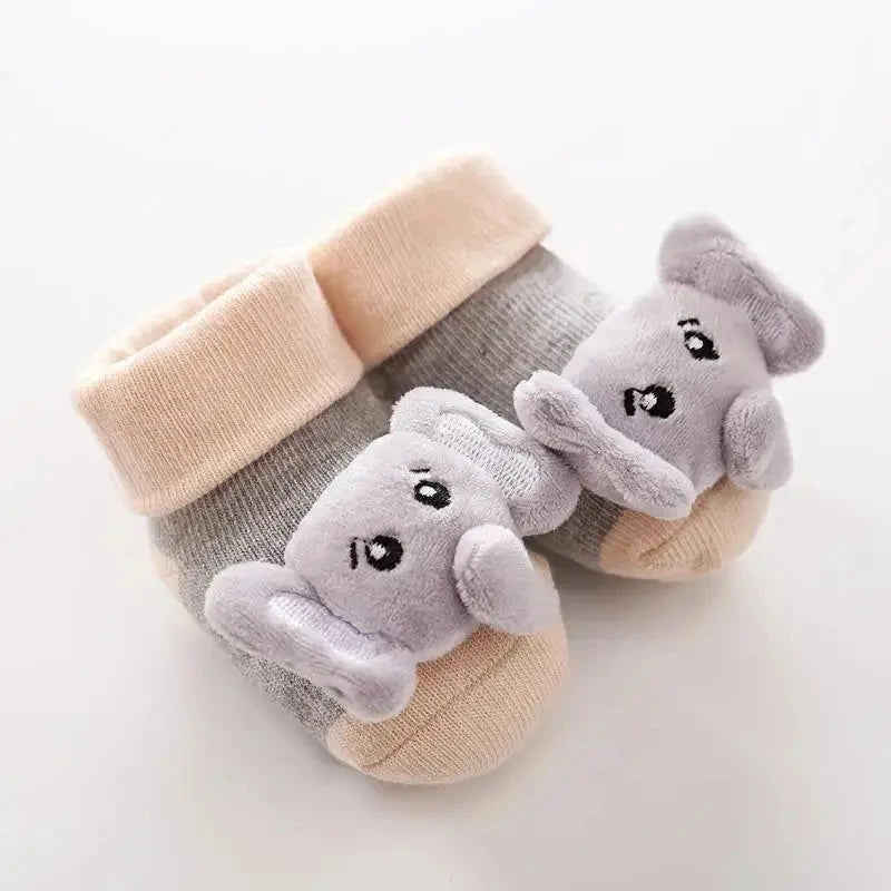 Cute cartoon baby anti-slip socks by SHOPEZRA L.L.C., featuring soft cotton, rattle design, for newborns and first steps.