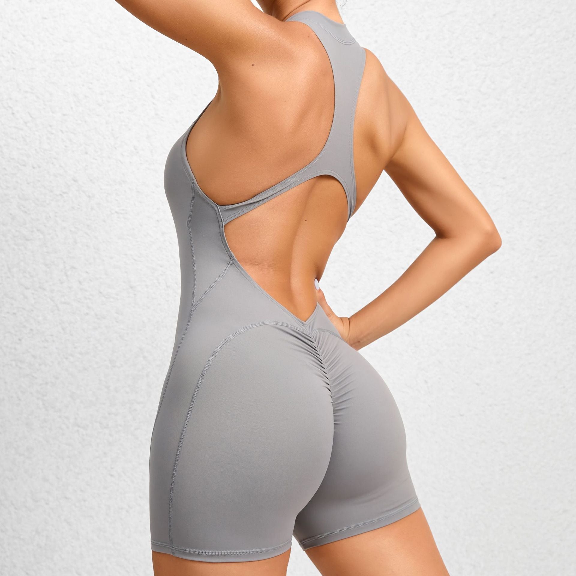 Non-Woven Enge Sporthose mit Reißverschluss Yoga-Hose Pfirsichpo Einteiliger schnelltrocknender plissierter Fitness-Jumpsuit