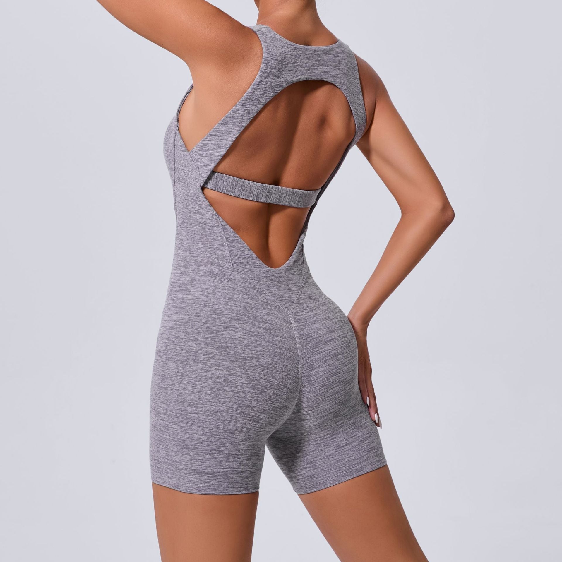 Herbst Sand Hollow Out Cutout Beauty Back Einteiliger Yoga Jumpsuit Skinny Schlankmachender Hüftstraffender Fitness Einteiler Sportbekleidung für Damen