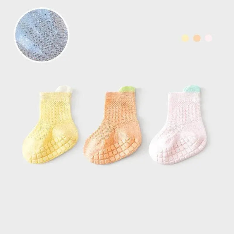 Six pairs of breathable, non-slip baby girl cotton socks in various colors, suitable for infants and young children.