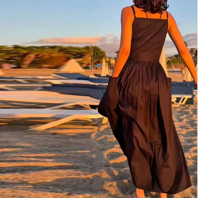 Elegant women's lace-up pleated dress with square neck, sleeveless design, high waist, and spaghetti straps, perfect for daily wear.