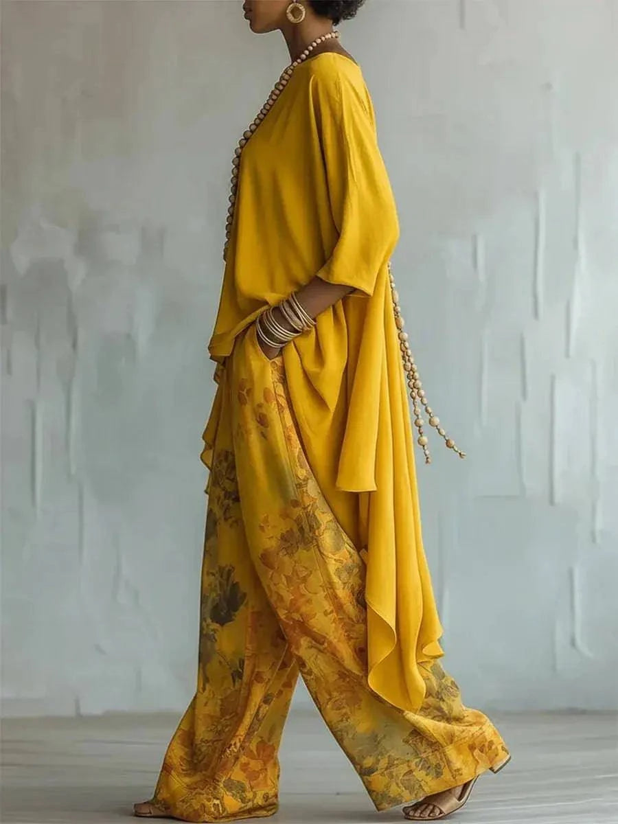 Casual two-piece solid color outfit with loose O-neck top and wide-leg printed pants, stylish and comfortable for everyday wear.