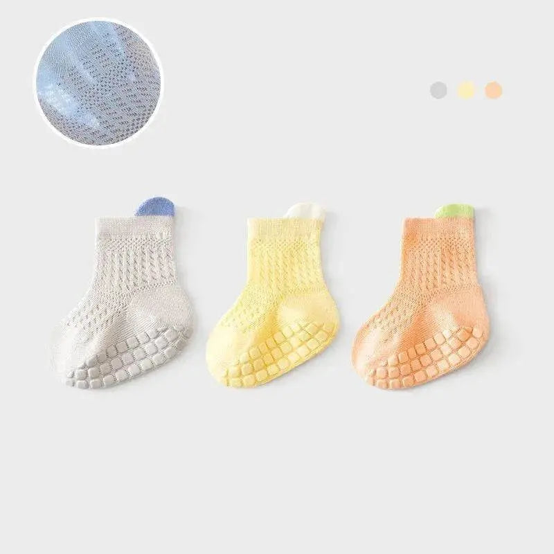 Set of 3 pairs of breathable, colorful non-slip baby girl cotton socks with mesh design, suitable for infants and toddlers.