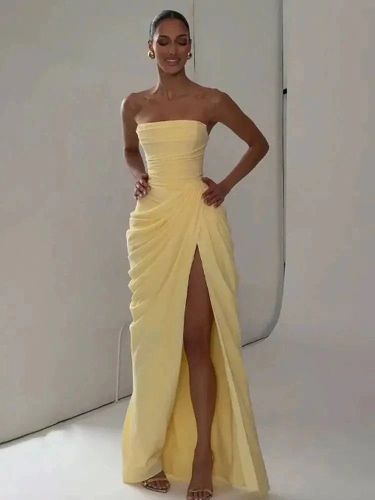 Elegant solid strapless pleated maxi dress for women, sleeveless with waist cinching and split, perfect for evening parties.