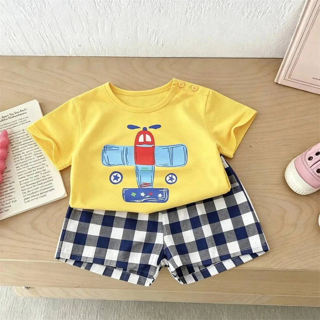 Boy wearing SHOPEZRA L.L.C. printed T-shirt and shorts two-piece casual sports set with cartoon design, perfect for toddlers.