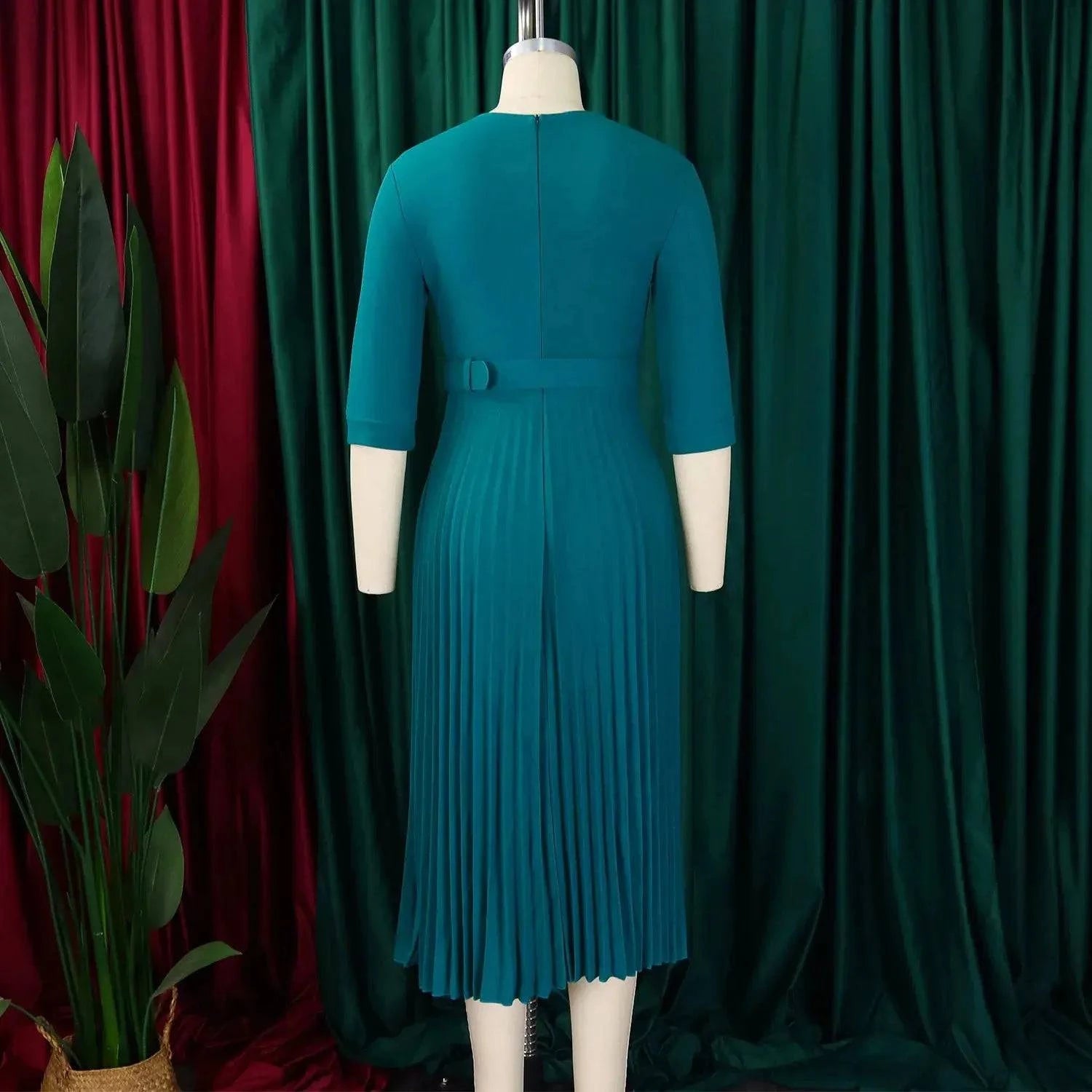 Elegant women's office dress by SHOPEZRA L.L.C. in fall colors, midi length with notched collar, half sleeves, and waist belt.