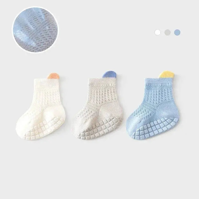 Set of three pairs of breathable, thin cotton baby girl socks in assorted colors, non-slip with mesh design for infants and kids.