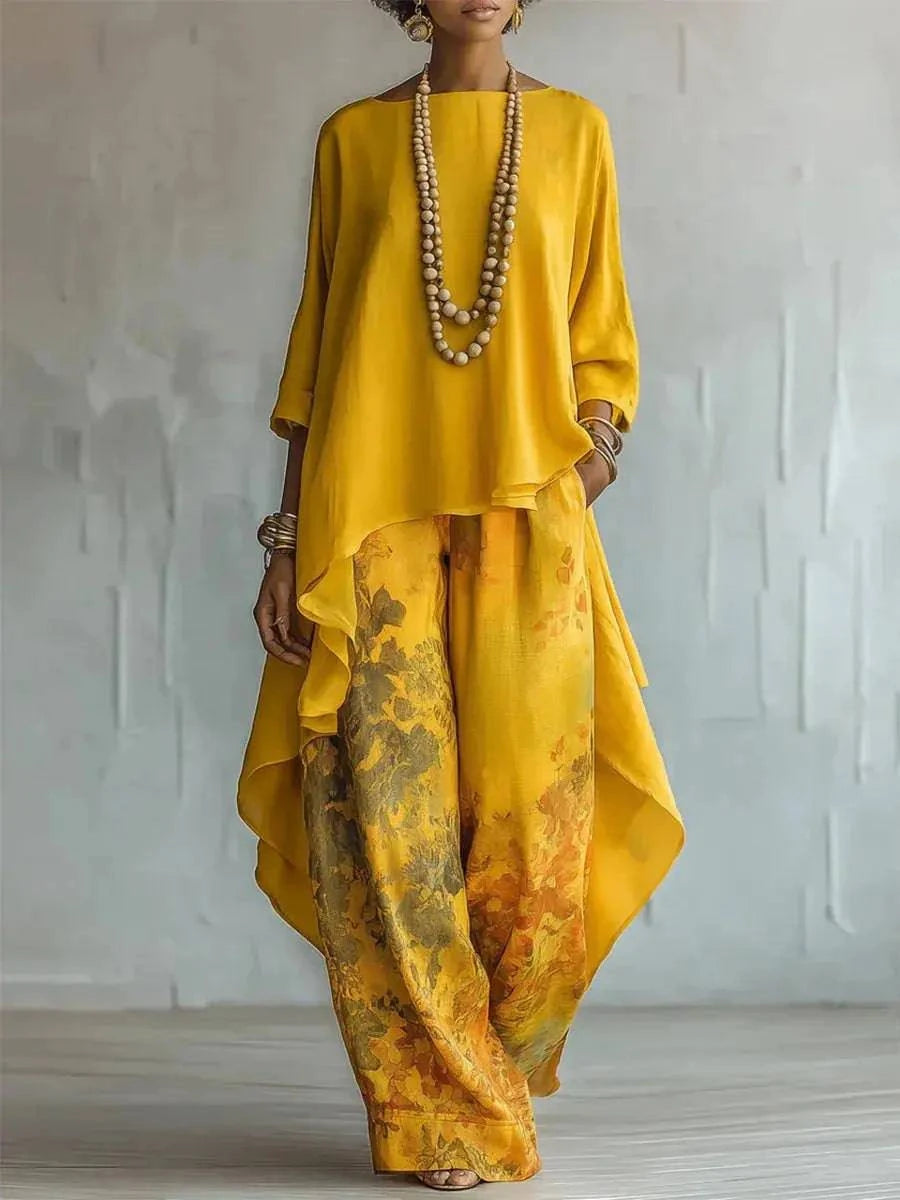 Casual two-piece set from SHOPEZRA L.L.C. featuring a loose O-neck top with 3/4 sleeves and wide-leg printed pants.