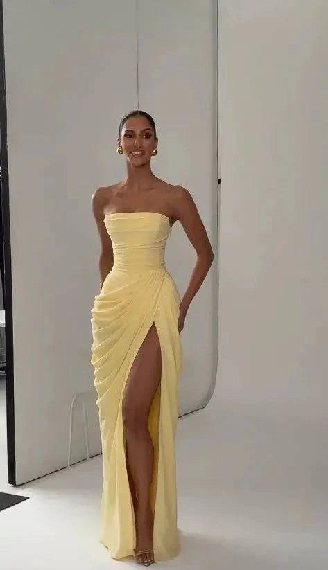 Elegant solid strapless pleated maxi dress for women by SHOPEZRA L.L.C., sleeveless with waist cinching and split for evening parties.