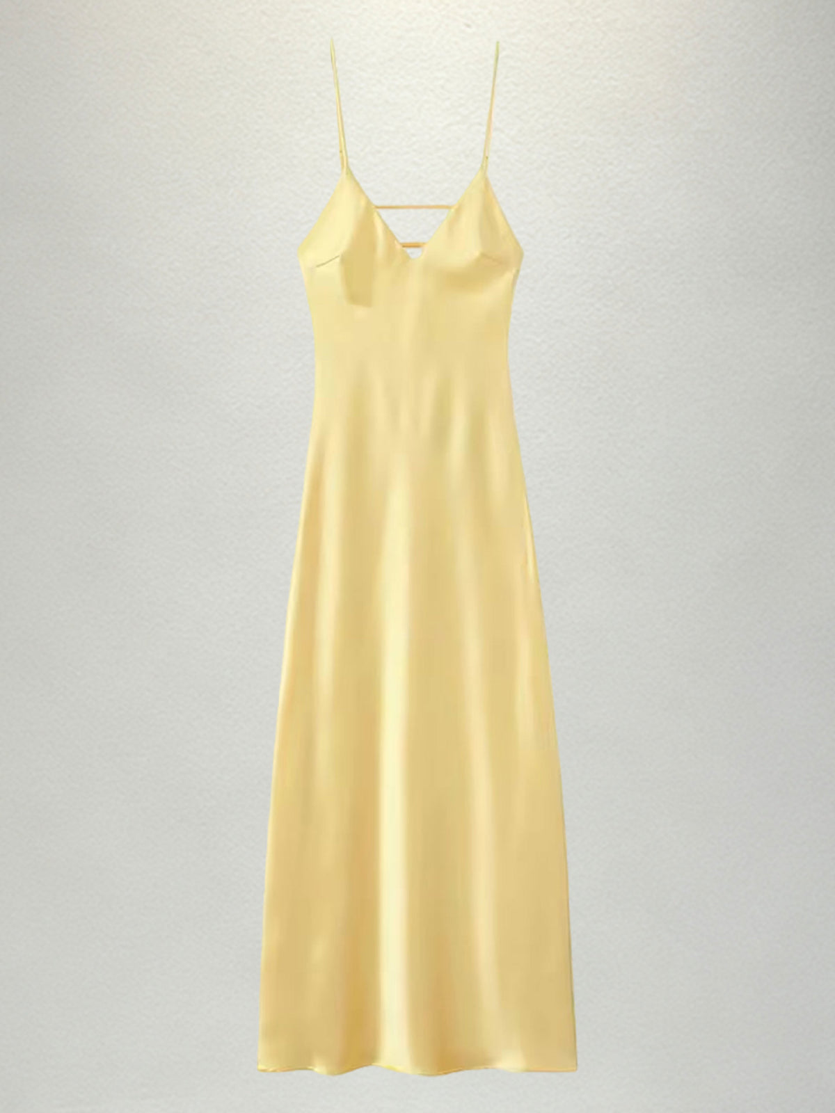 New French-style summer fresh satin slip dress with delicate spaghetti straps and a deep V-neck for an elegant look