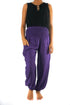 Purple women boho pants made of lightweight rayon with elastic waist and ankles, featuring a loose, flowy fit ideal for yoga and casual wear.