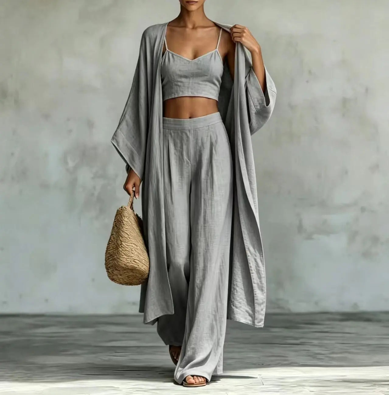 Dropshipman apricot three-piece set with cardigan, camisole, and high-waisted wide-leg pants, styled for a chic, casual look.