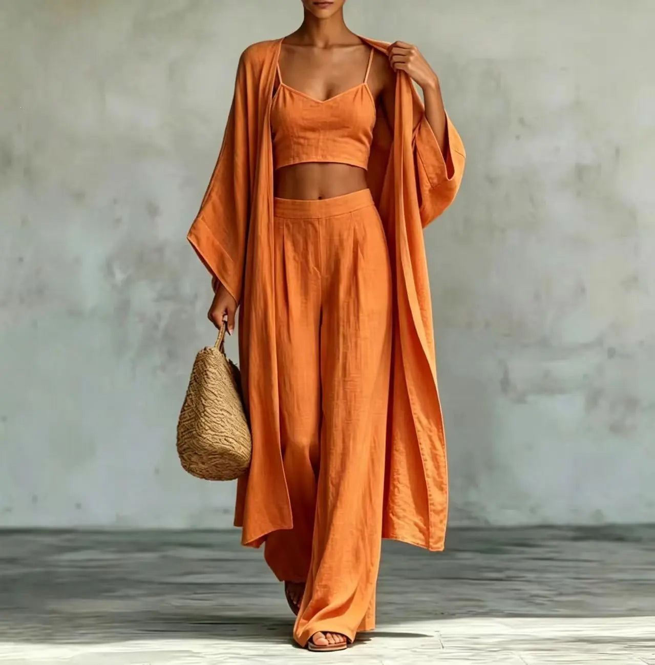 Apricot three-piece set with cardigan, camisole, and high-waisted wide-leg pants from Dropshipman, styled for casual wear.