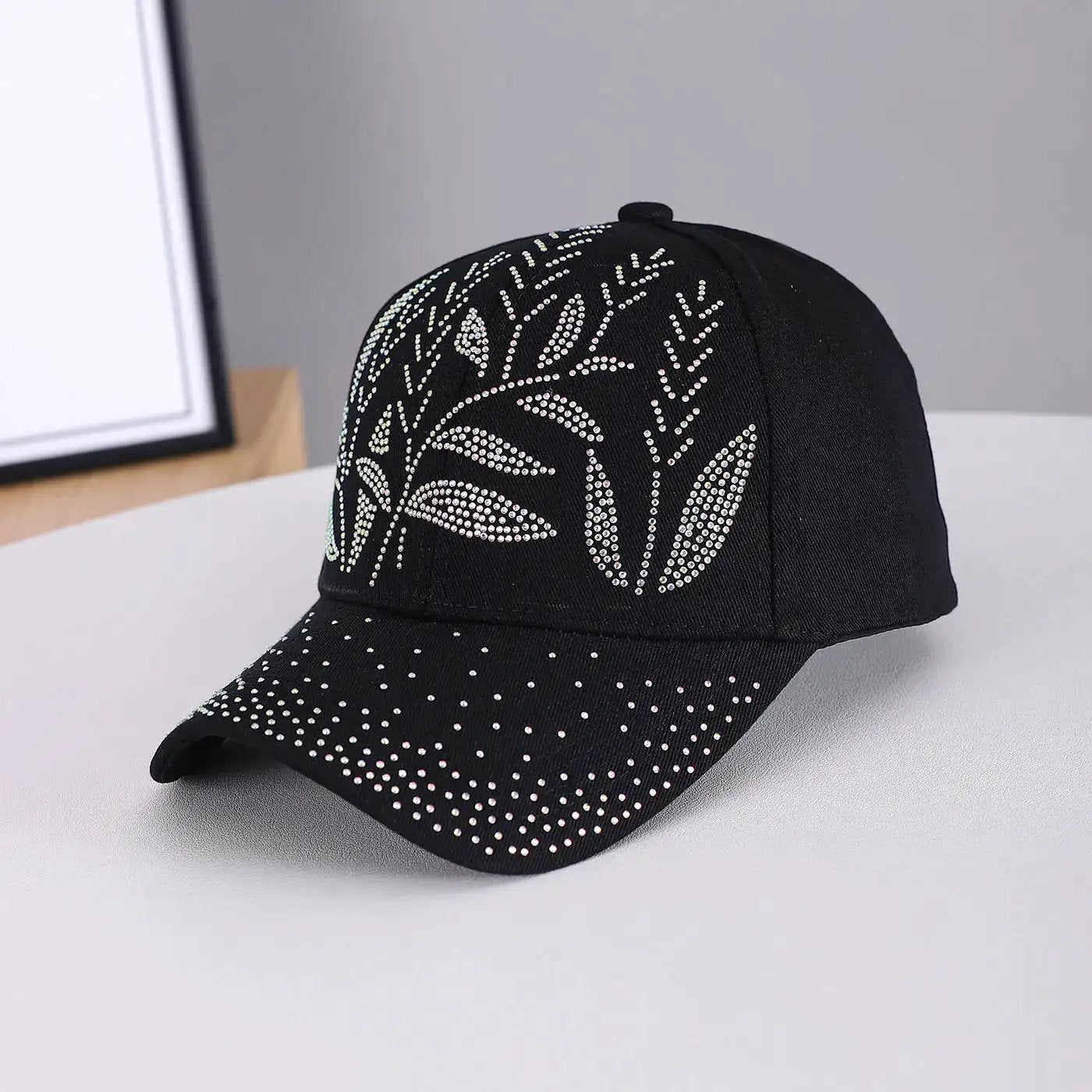 Black adjustable baseball cap with leaf-shaped beaded pattern, made of twill fabric, ideal for men's and women's outdoor casual wear.