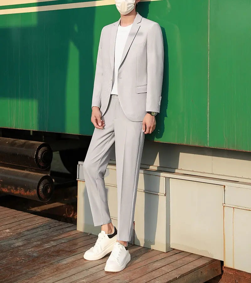 Black slim-fit spring and autumn suit set by Dropshipman, featuring a trendy casual jacket and matching pants.