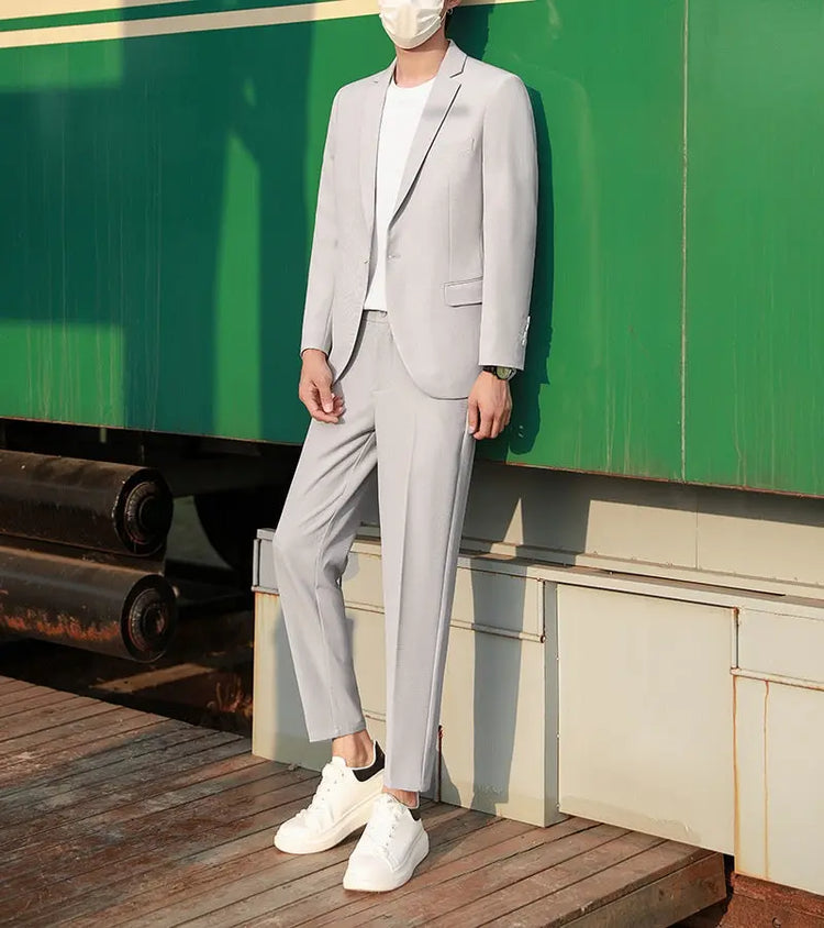Black slim-fit spring and autumn suit set by Dropshipman, featuring a trendy casual jacket and matching pants.