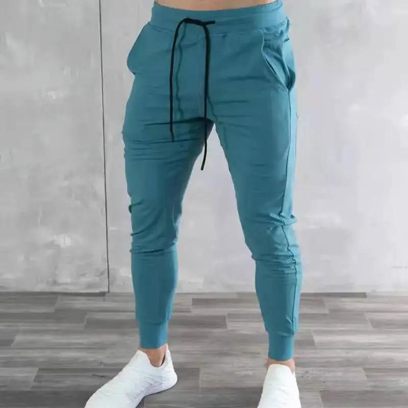 Light blue Korean version slim fit men's fitness jogger pants by Dropshipman, showcasing comfortable athleticwear with tapered fit