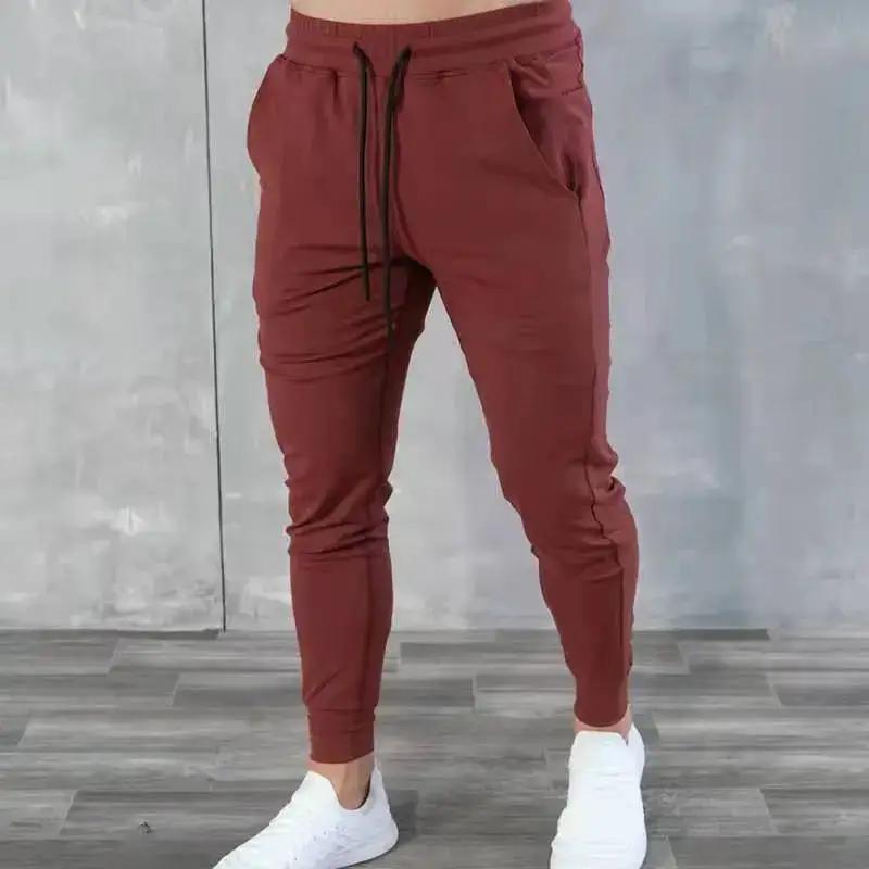 Light blue Korean version slim fit men's fitness jogger pants by Dropshipman, showing the comfortable, tapered design and elastic waistband.