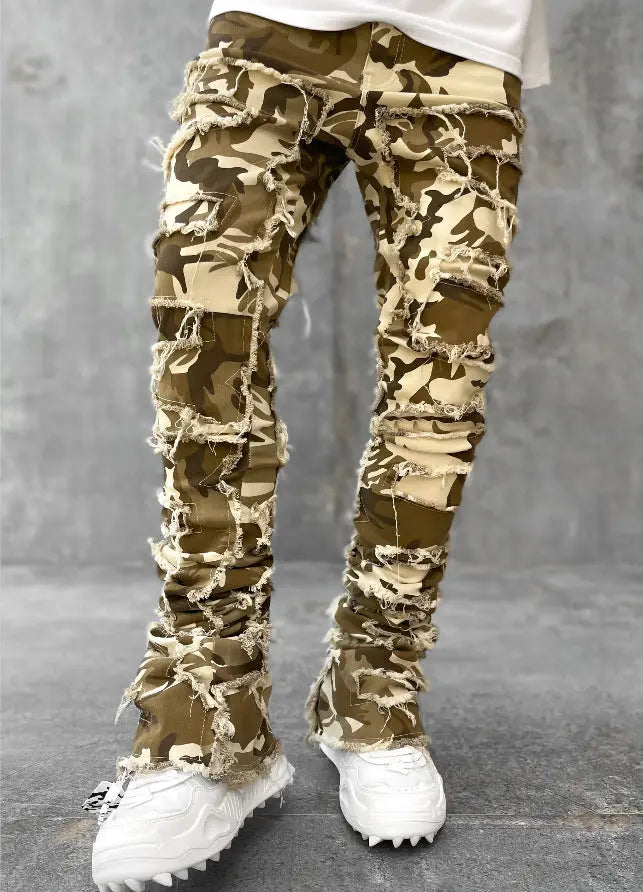 Pink ripped jeans for men featuring fringes, patched details, long tight fit, and stacked design by Dropshipman.