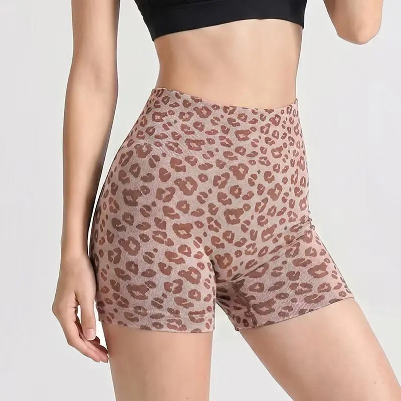 Black leopard-print yoga shorts for fitness and exercise by Dropshipman, featuring breathable, stretchy fabric for active wear.