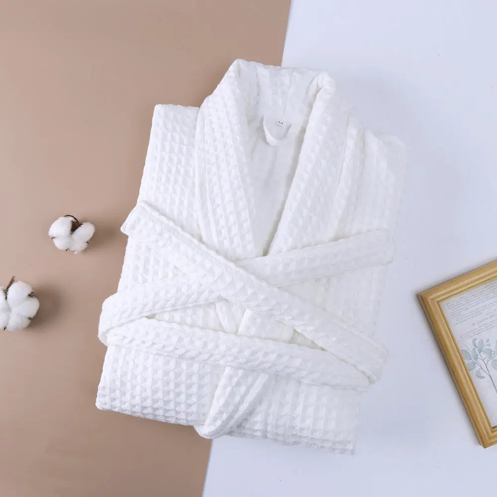 White cotton double waffle unisex long robe with thickened fabric, featuring a cozy, relaxed fit and long sleeves.