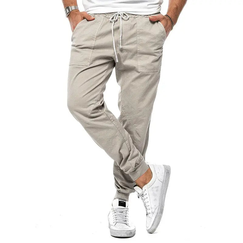 White men's casual spring and autumn tapered loose trousers by Dropshipman, ideal for leisure, sports, and outdoor wear.