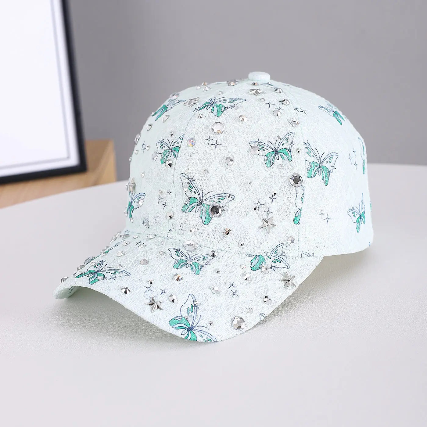 Lady's lace butterfly silver diamond star accessory paired with a white pink street style baseball cap, perfect for outdoor and casual wear.