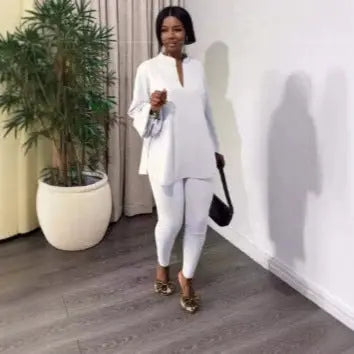 White solid color two-piece outfit featuring a split V-neck top and skinny pants by Dropshipman.