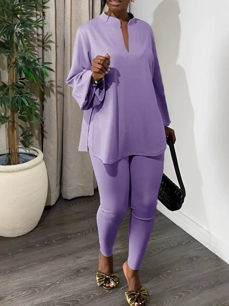 White solid color split V-neck top and skinny pants two-piece outfit by Dropshipman, featuring a casual, stylish ensemble.