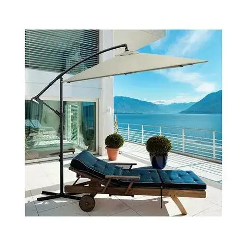 Ezra beige and grey Milano outdoor cantilever umbrella providing shade for garden and patio areas.