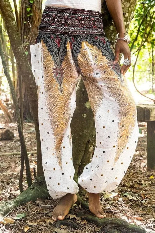 Ezra white peacock harem pants with boho style, suitable for yoga and festival wear, featuring relaxed fit and intricate patterns.