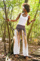 White peacock Harem pants by Ezra, boho yoga and festival pants with relaxed fit and intricate peacock print detail.