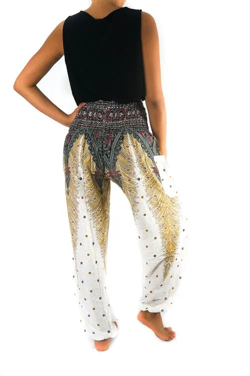 Ezra white peacock harem pants with boho style, featuring wide legs and intricate peacock print, ideal for yoga or festival wear.