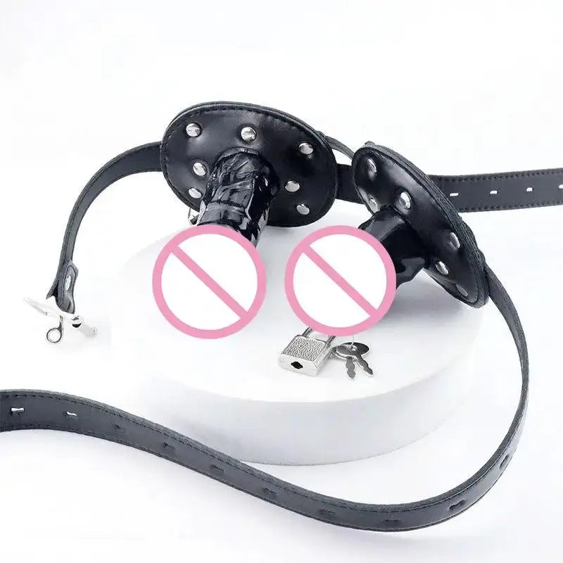 Pink dildo and open mouth gag with leather strap, lock, and butt plug for bondage restraint, designed for couples' sex play.