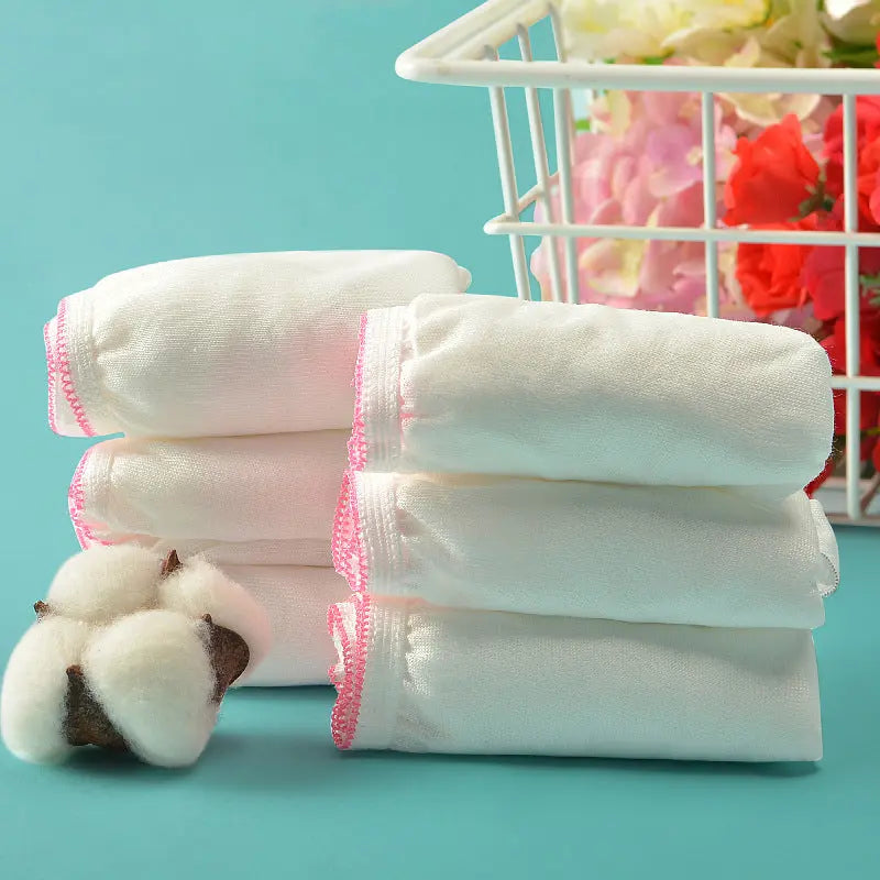 White disposable women's underwear triangle style, individually packaged, suitable for maternity, travel, and sterile cotton comfort.
