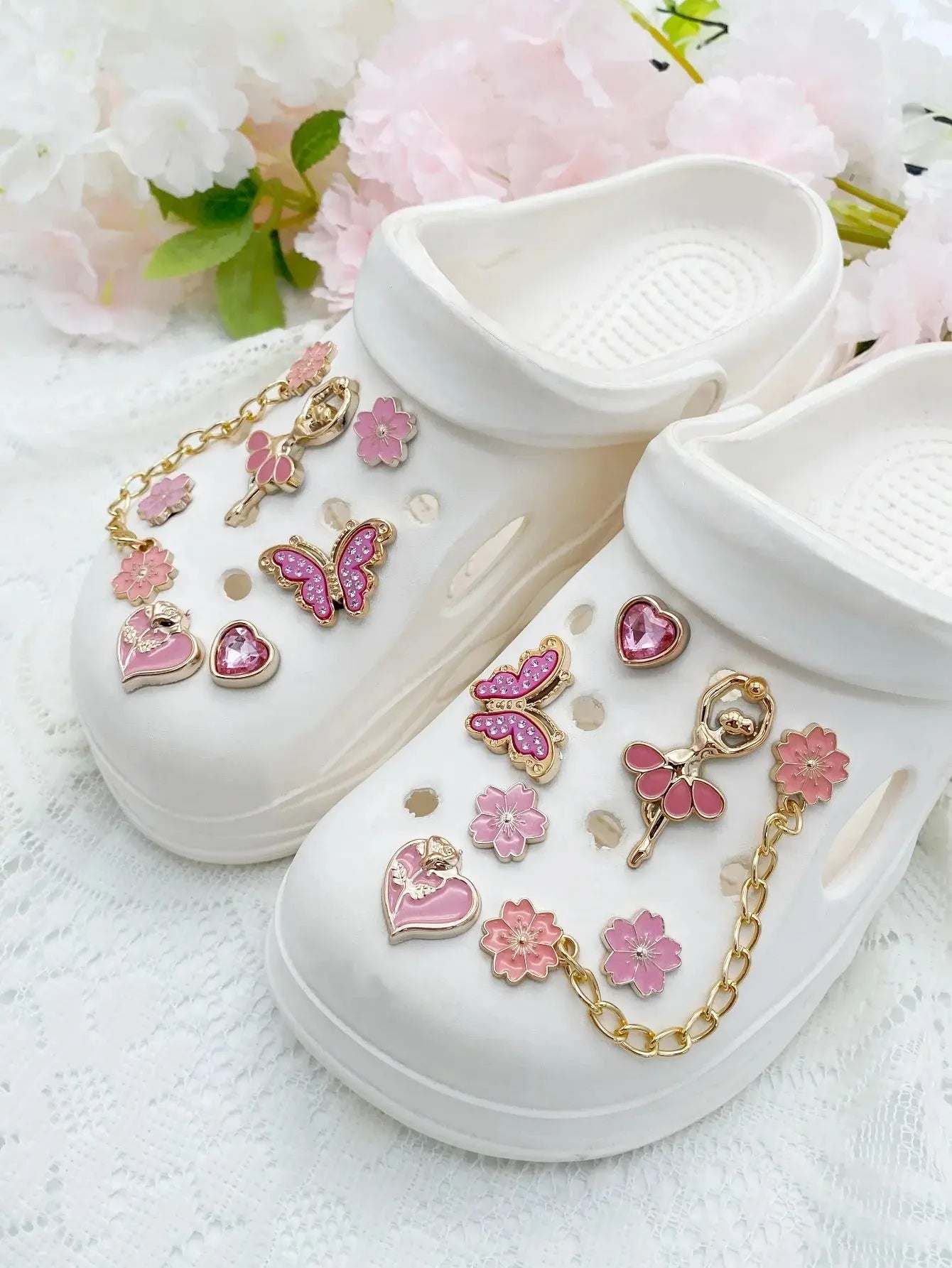 14pcs fashion ABS shoe charms with pink flowers, butterflies, hearts, and flower chains for DIY sandal decoration.