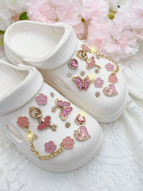 14pcs SHOPEZRA fashion ABS shoe charms with pink flowers, butterflies, hearts, and flower chains for DIY sandal decorations.