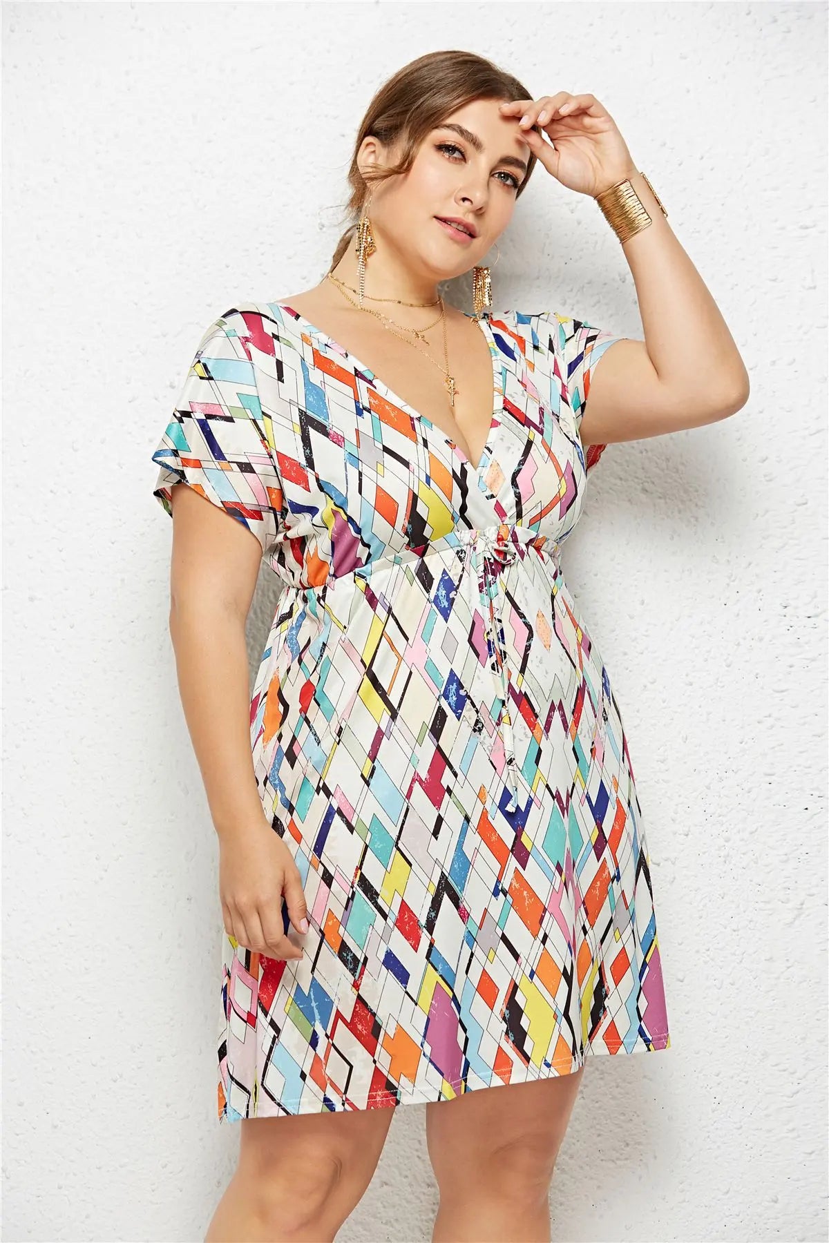 Printed deep V-neck dress with elastic waist by SHOPEZRA L.L.C., shown in a stylish, flowy design on a model.